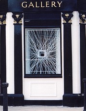 STRETCHED II (view from street)  2002 200 x 200 x 80cm Box: 60cm sq.  (size adapted to site)    Painted dexion steel, polypropylene rope, steel eyelet fixings & painted MDF board fitted in window Exhibited at Morley Gallery, London SE1